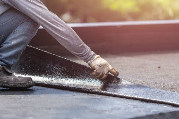 Professional Emergency Waterproofing technician working in Carrollton, MI